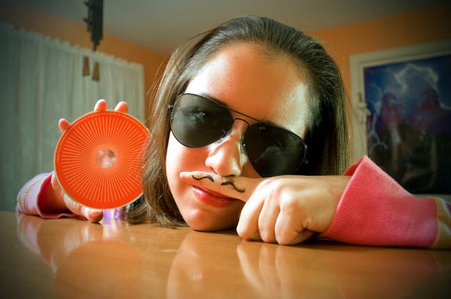 Weird girl holding a CD