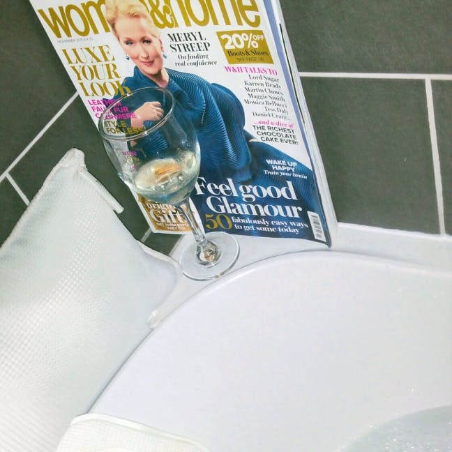 in the bath with woman and home  magazine